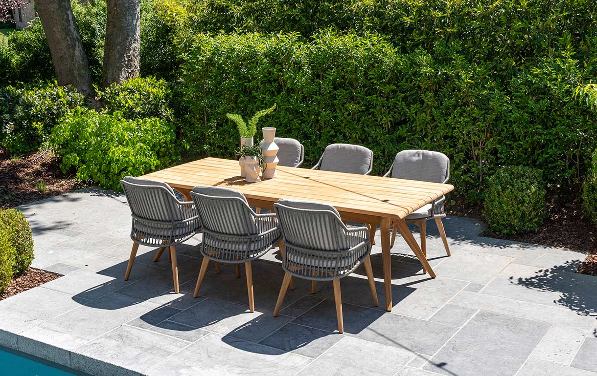 wooden rectangular dining set with six rope garden dining chairs