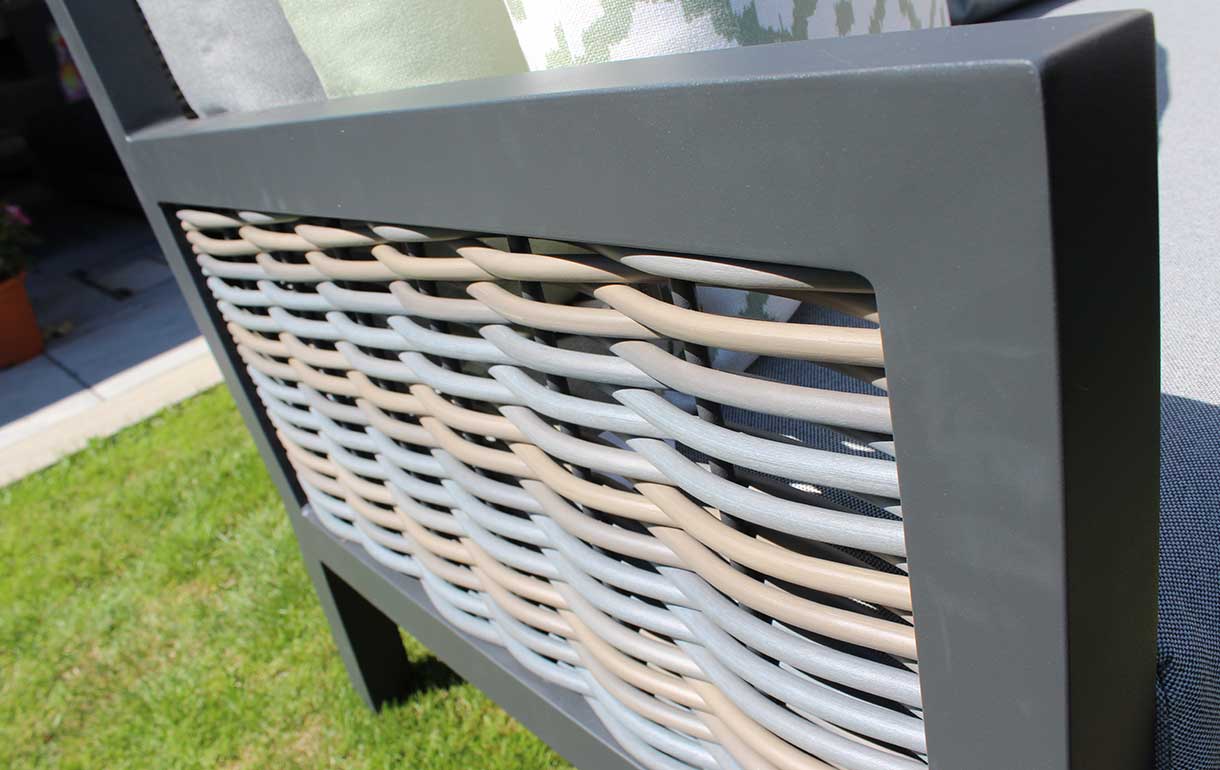 Close-up of chunky rattan and aluminium garden furniture