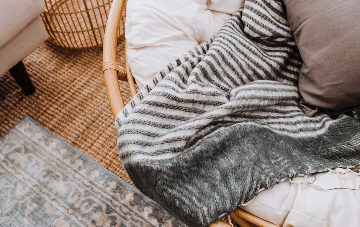 Cane papasan chair with blankets