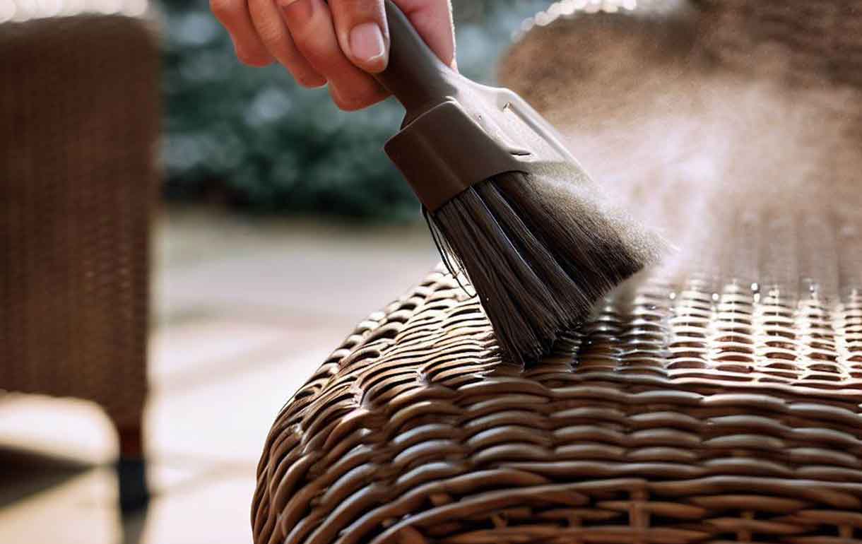 Dusting garden furniture with a soft brush