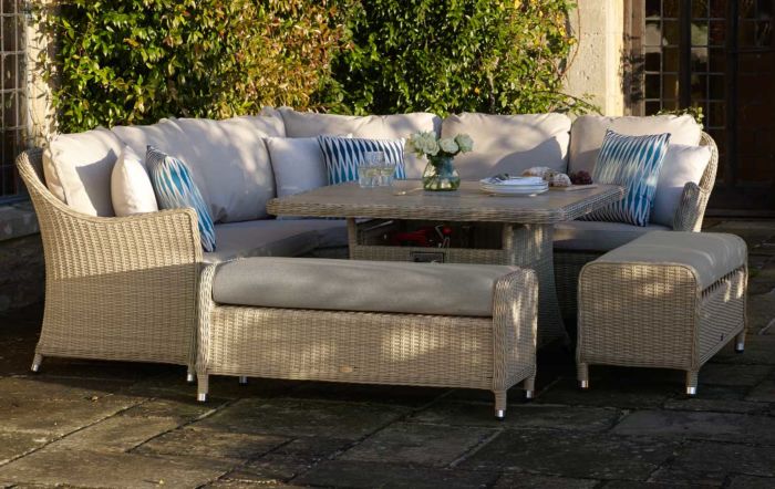 Corner rattan garden sofa with square adjustable table including benches