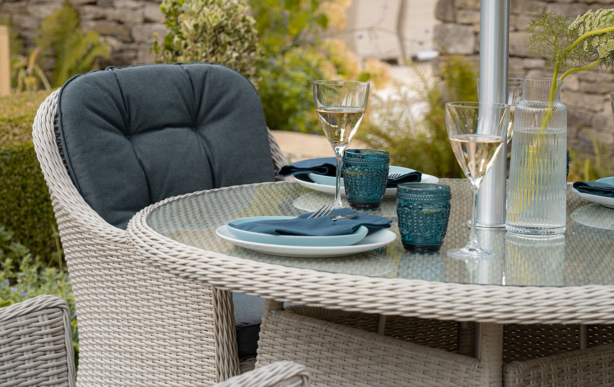 Rattan garden dining furniture with glass table top
